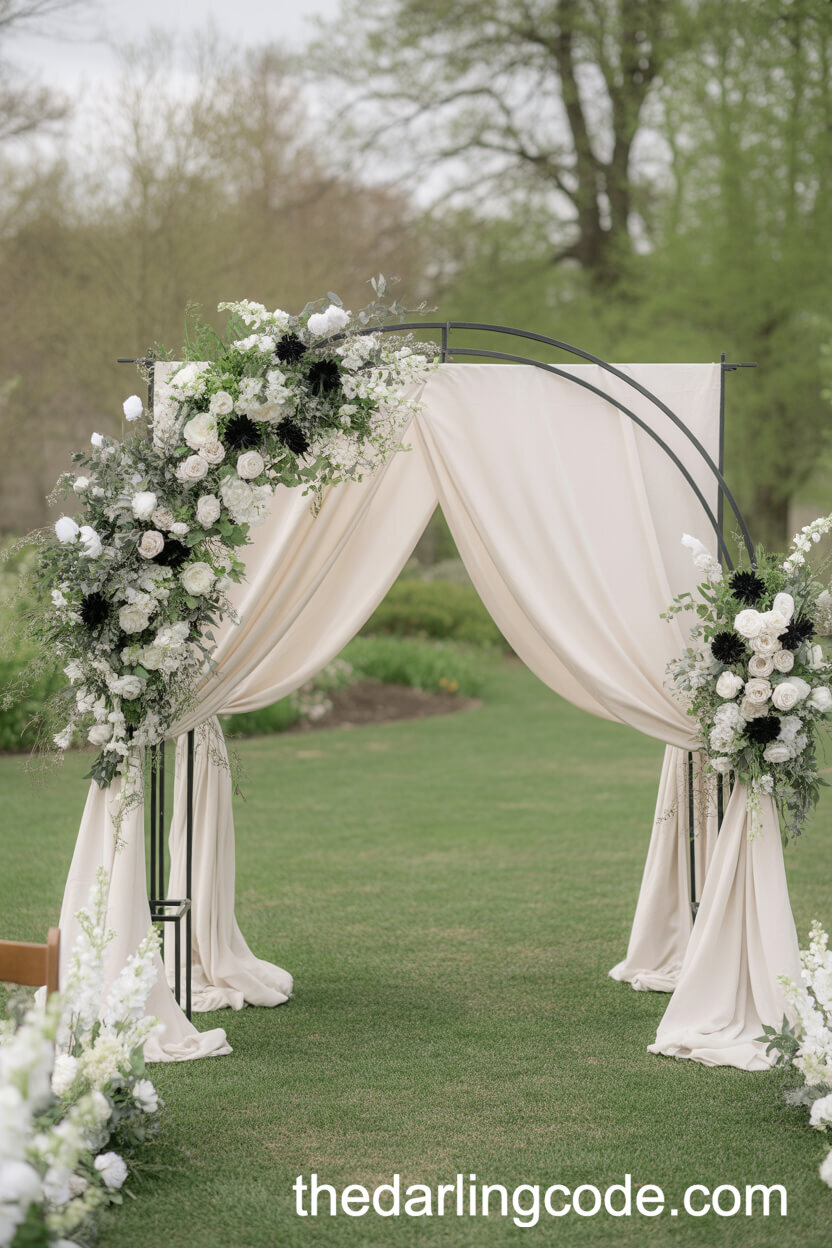 Black Metal Archway with White Draping and Florals