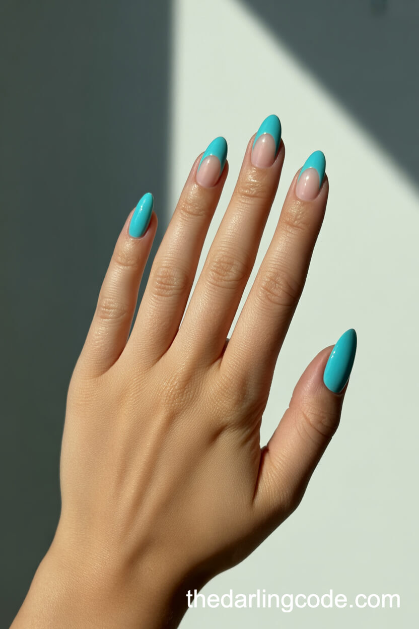 Turquoise Almond Nails With Nude Half-Moon Design