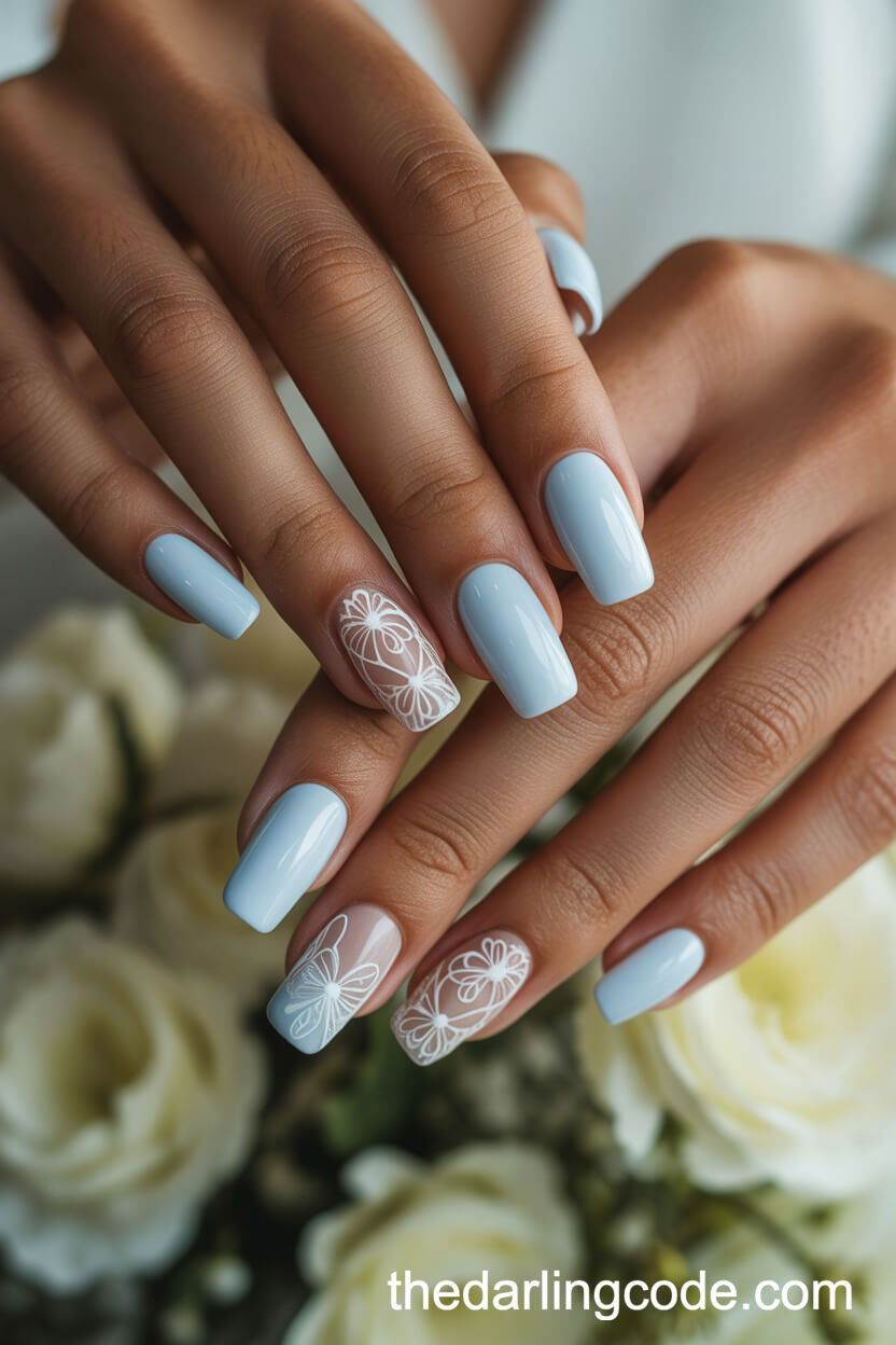 Pale Blue Coffin Nails With White Lace Designs