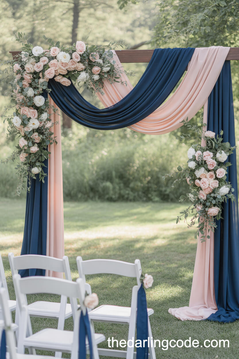 Romantic Fabric-Draped Ceremony Arch With Navy And Blush Florals