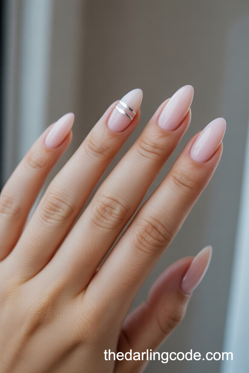 Milky Pink Almond Nails With Silver Stripe Accent