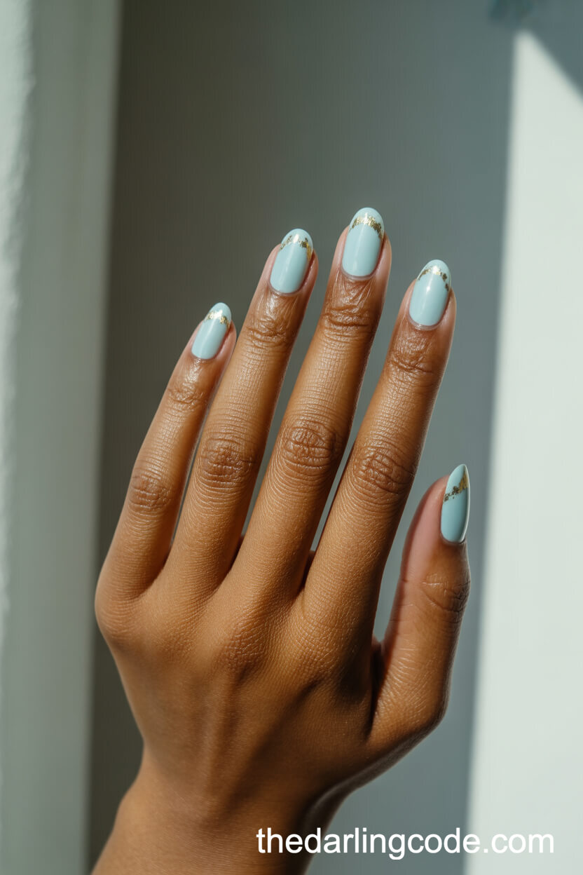 Pastel Blue Oval Nails With Gold Foil Accents